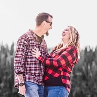 A couple embracing each other and laughing A couple embracing each other and laughing